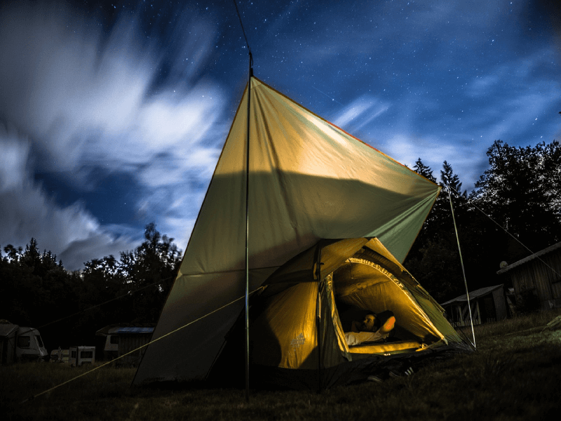 Someone in a tent with a covering 